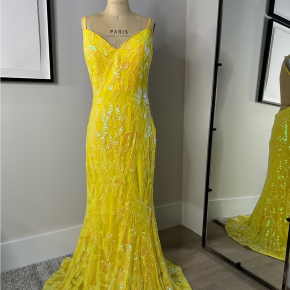 JoVani Yellow Dress
The Jovani 07784A Yellow Pattern Sequin Embellished Gown - Picture 2 of 7